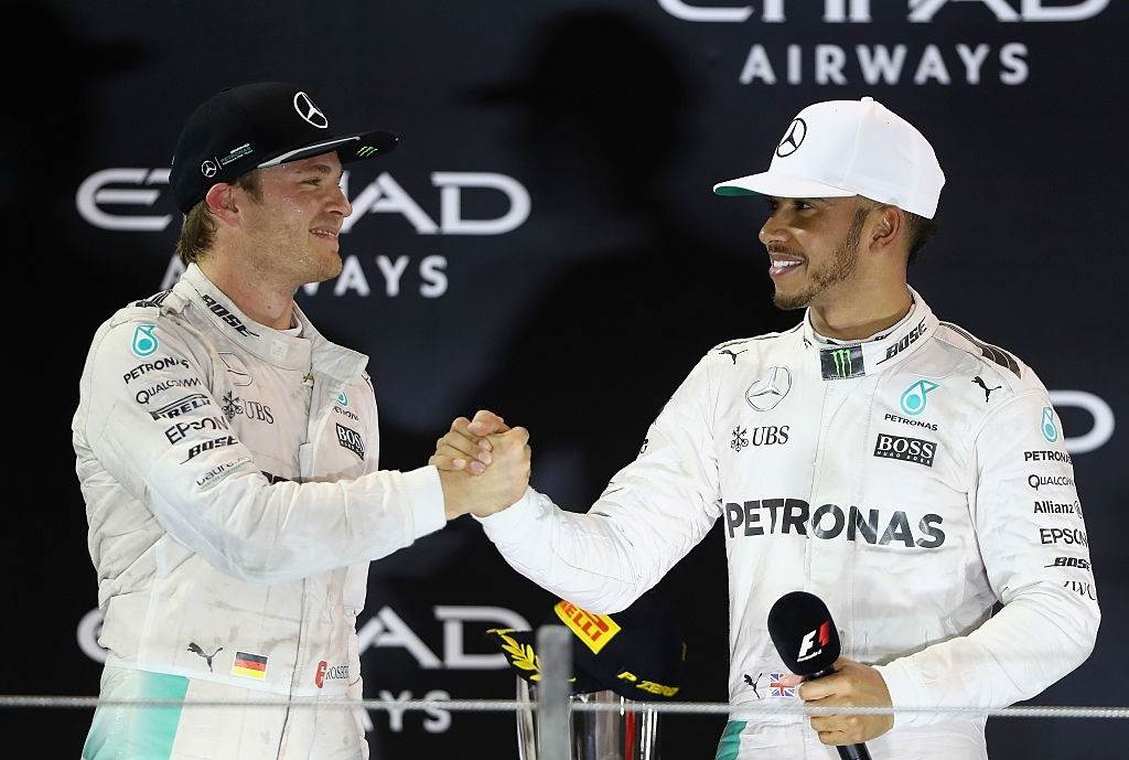 Nico Rosberg shaking hands with Lewis Hamilton