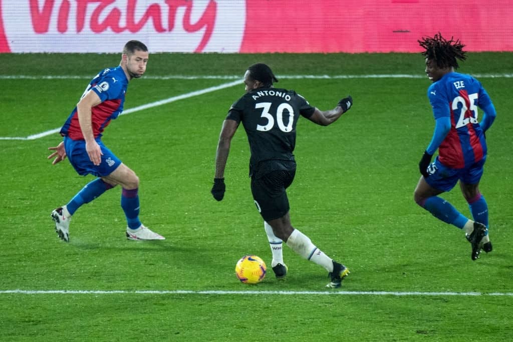  Michail Antonio of West Ham United and Gary Cahill and Eberechi Eze of Crystal Palace