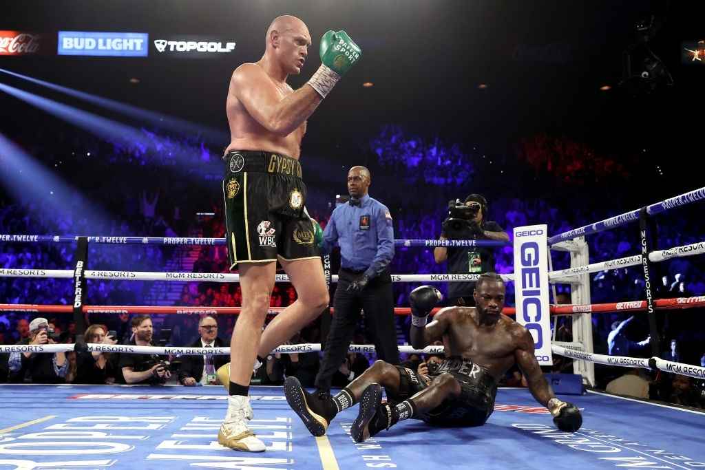 Tyson Fury knocks down Deontay Wilder