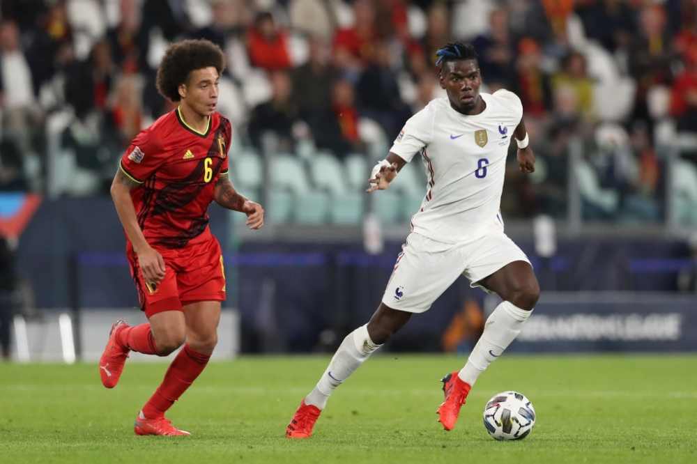 Paul Pogba of France takes on Axel Witsel of Belgium during the UEFA Nations League 2021 Semi-final match between Belgium and France at Juventus Stadium on October 07, 2021 in Turin, Italy. (Photo by Jonathan Moscrop/Getty Images)