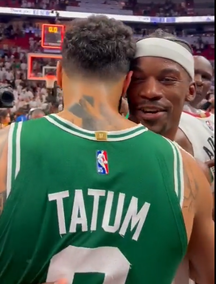 Jimmy Butler embracing Jayson Tatum