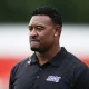 Willie McGinest tries to defend himself.