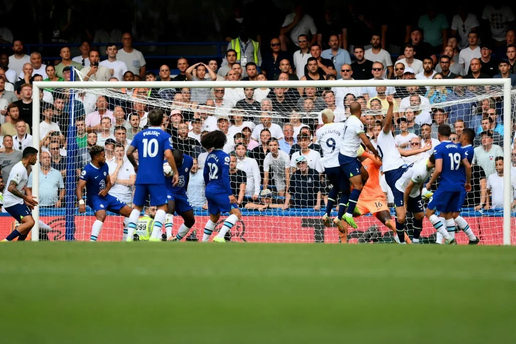 Harry Kane of Tottenham Hotspur scores their sides second goal during the Premier League match between Chelsea FC and Tottenham Hotspur at Stamford Bridge on August 14, 2022 in London, England.