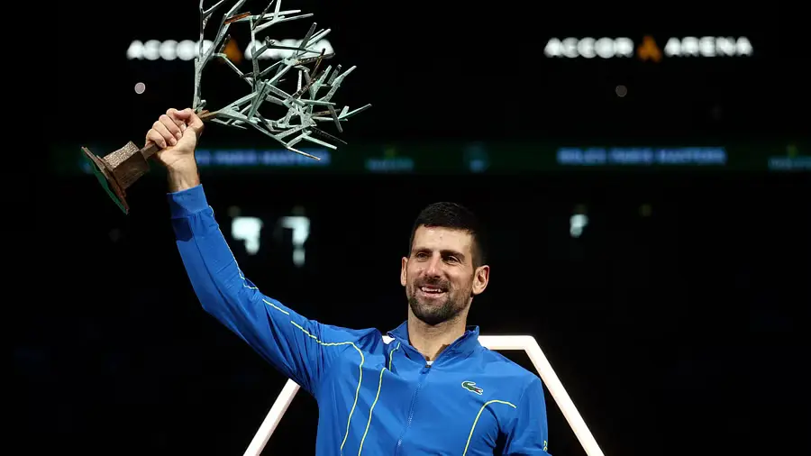 Serbia's Novak Djokovic celebrates with the trophy after winning his men's singles final match against Bulgaria's Grigor Dimitrov

Read more at: https://www.deccanherald.com/sports/tennis/djokovic-eases-past-dimitrov-to-win-record-extending-paris-title-2757853
