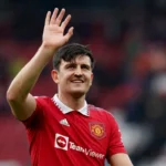 Who is Isaac Adongo apologizing to Harry Maguire?